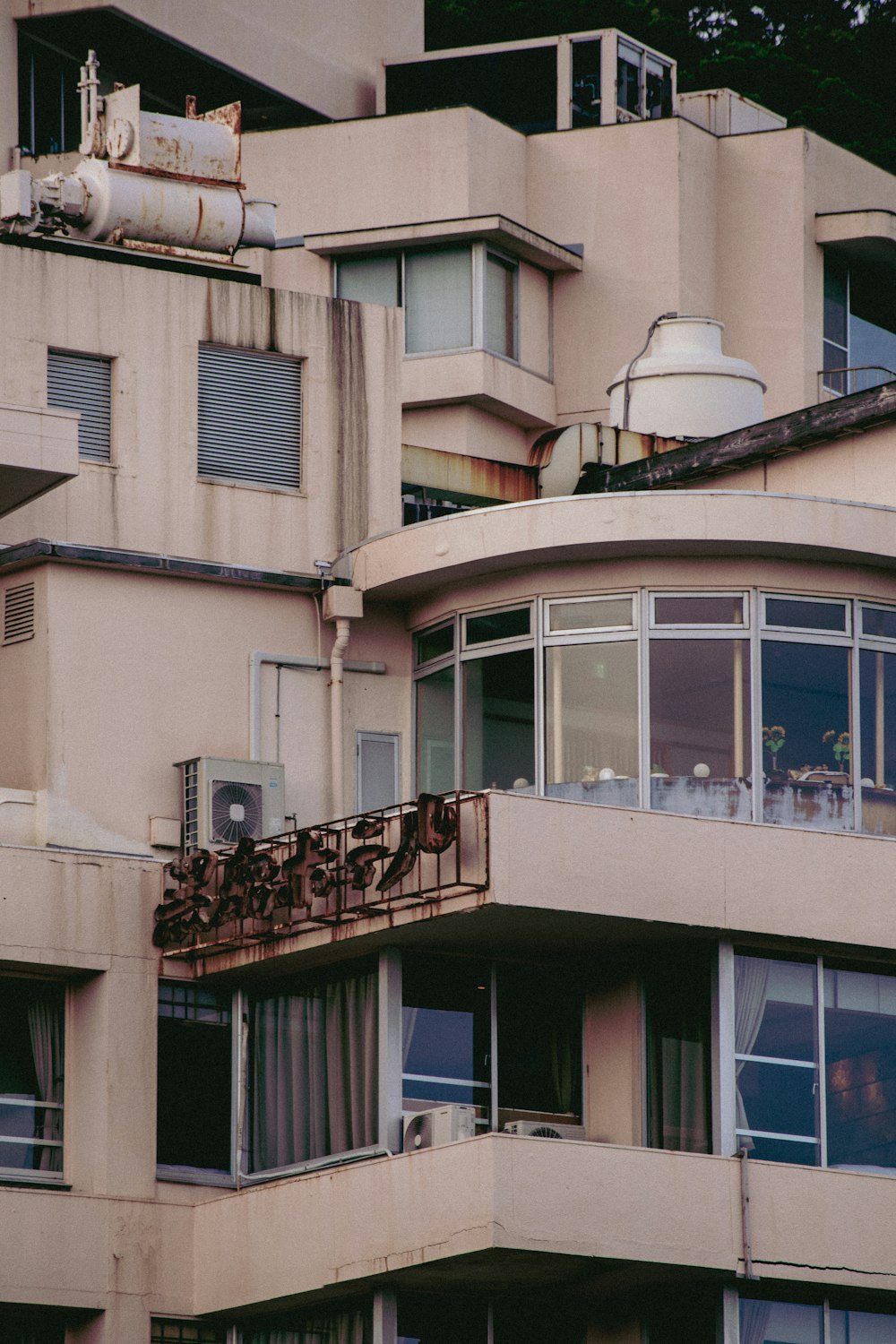 a tall building with lots of windows and balconies