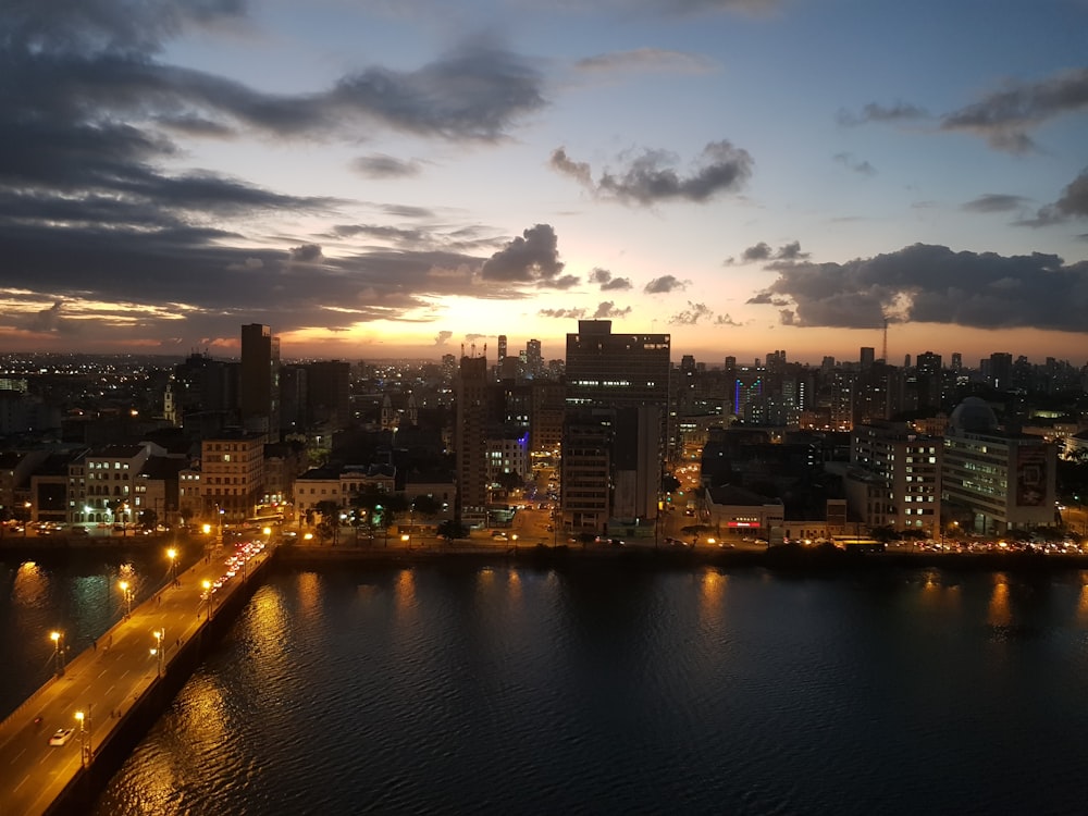 a large body of water with a city in the background