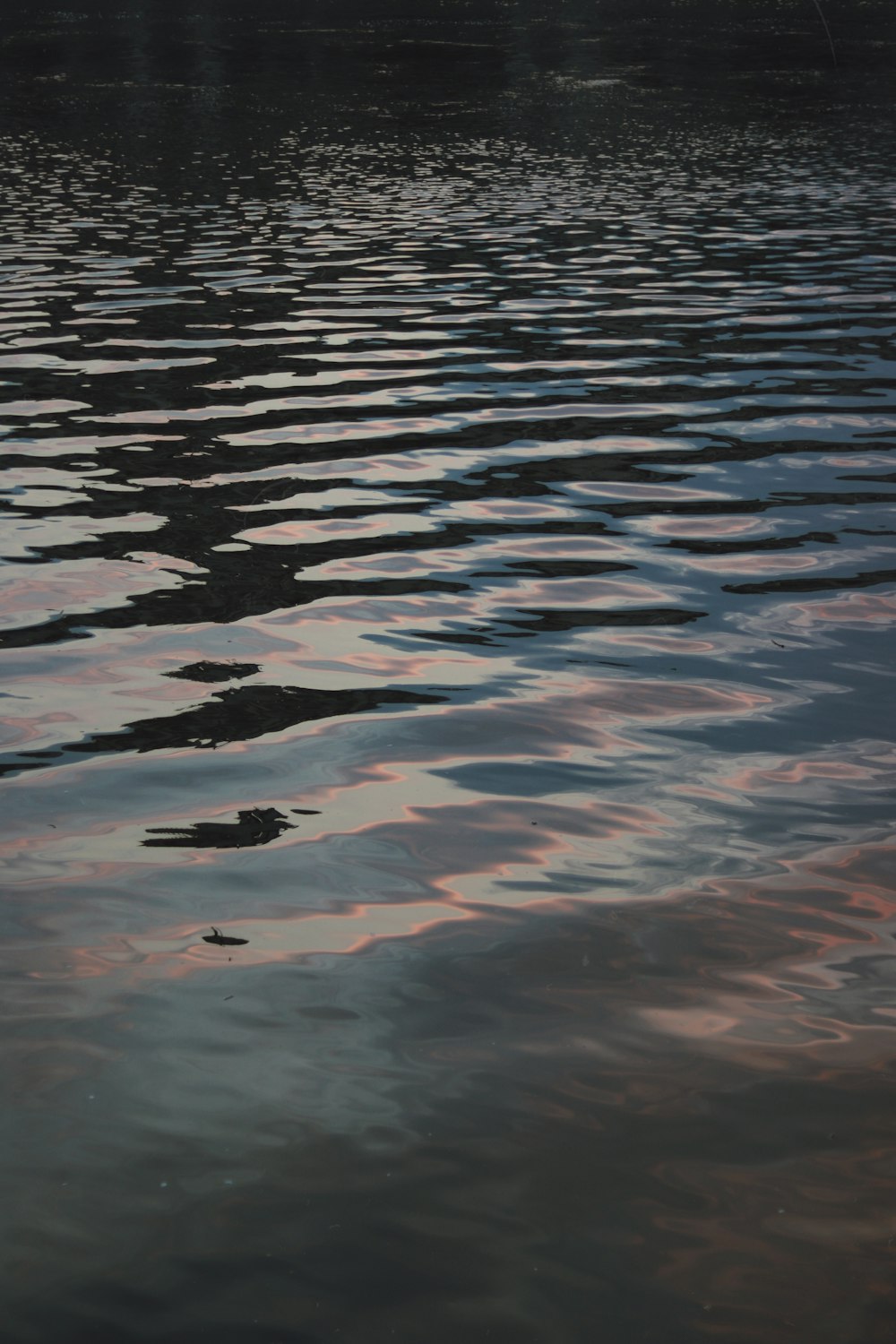 a body of water with a boat in the distance