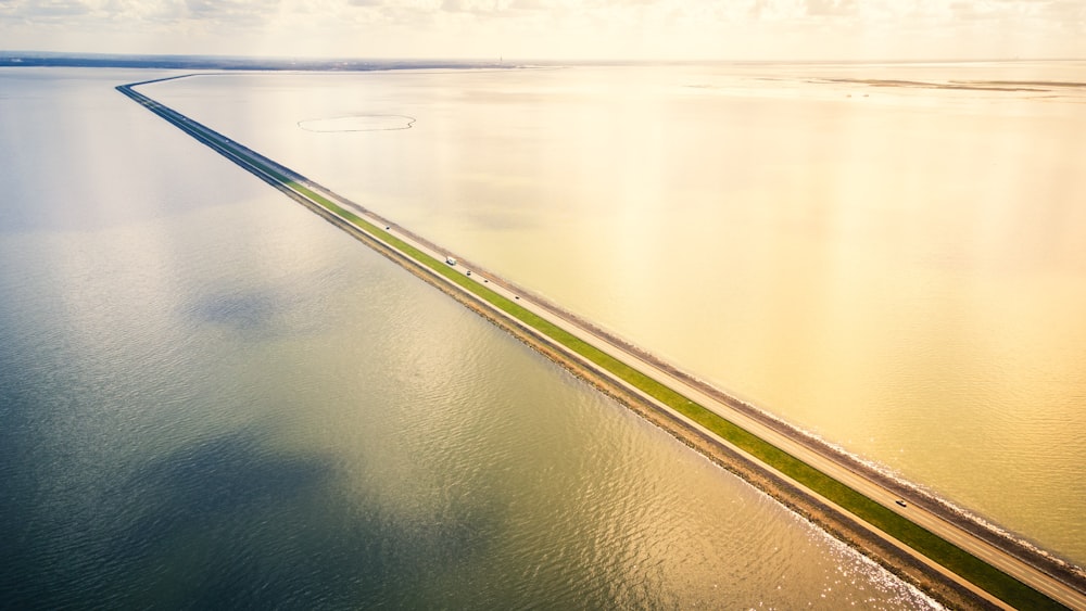 an aerial view of a highway crossing over water