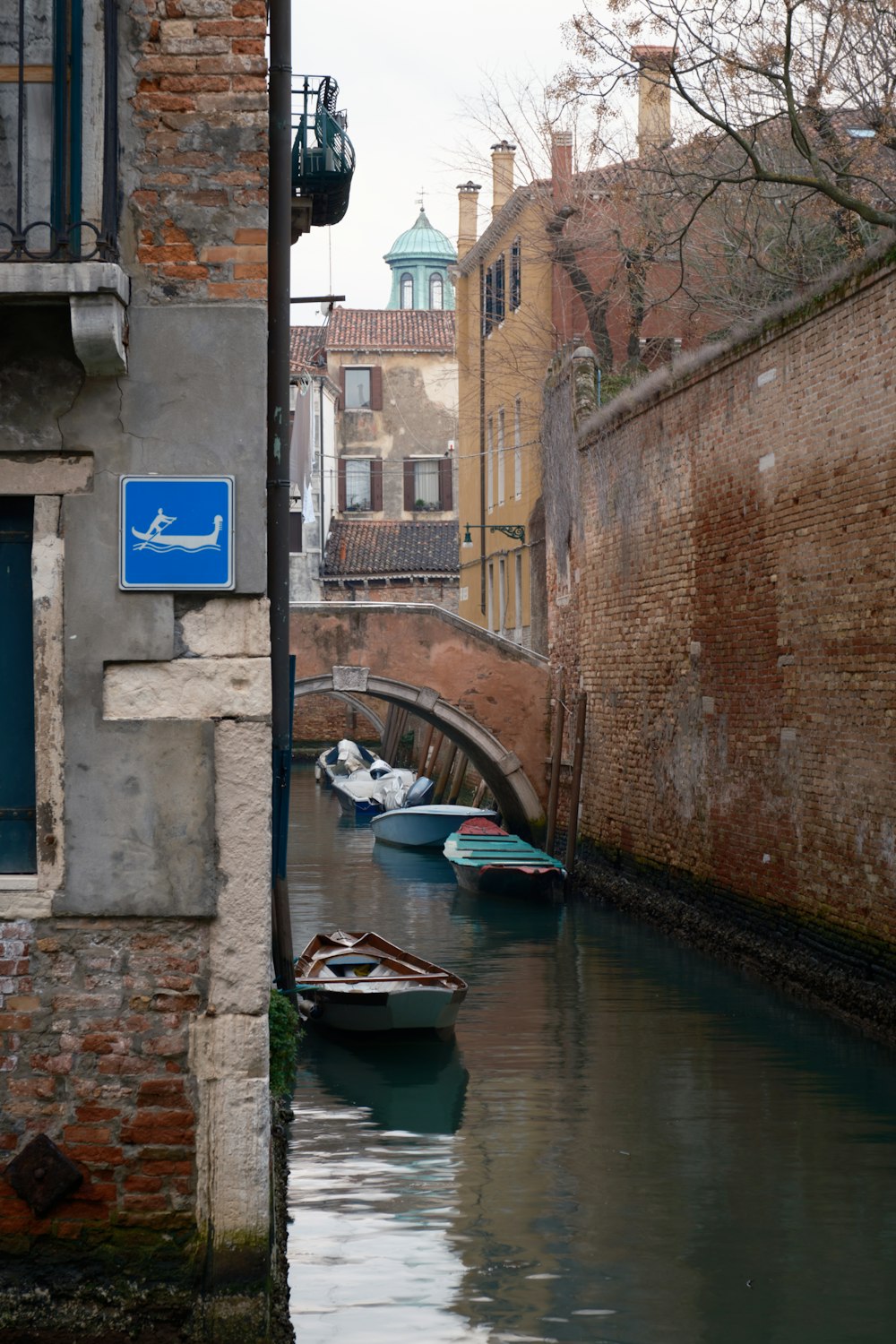 a canal with several small boats in it