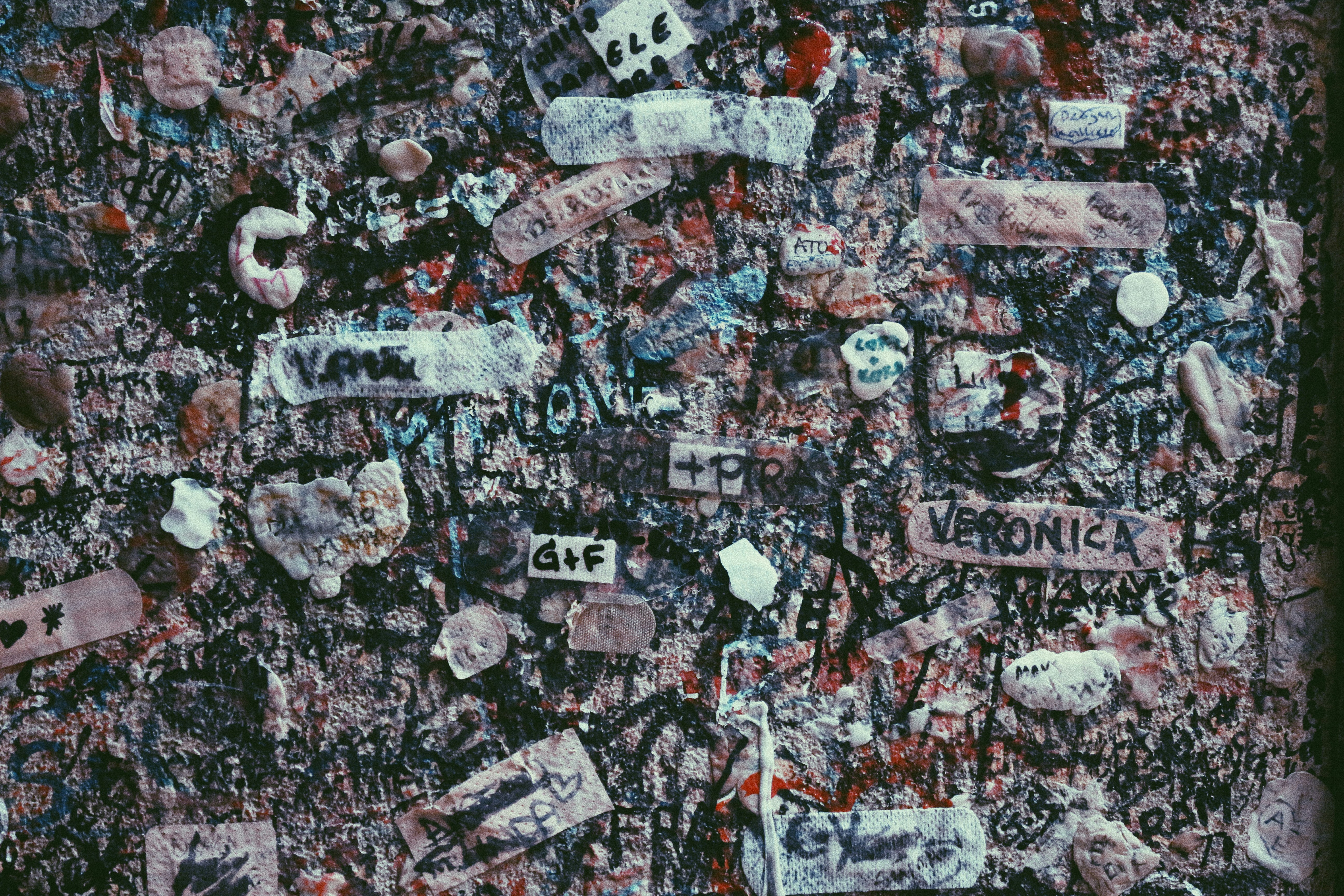 a wall covered in lots of different types of stickers