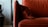 A close-up of plush pillows arranged on a stylish armchair.