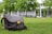 A satisfied customer showcasing their SlingAura bag in a park.