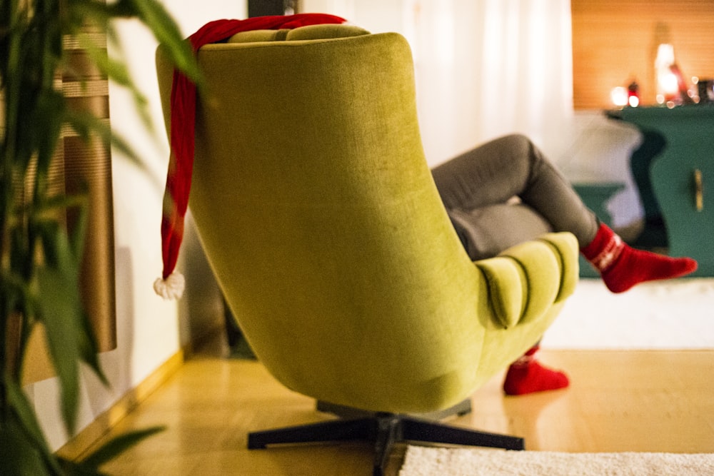 a woman sitting in a chair with a foot rest