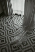 Elegant bridal gown displayed in soft natural light