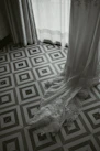 Display of ready-to-wear robes in soft, neutral tones reflecting purity and elegance