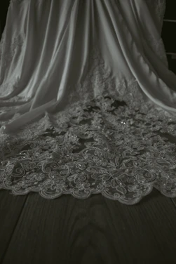 Close-up of luxurious black and white latha fabric draped elegantly.