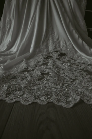 Close-up of luxurious black and white latha fabric draped elegantly.