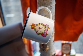 A charming mug adorned with whimsical illustrations.
