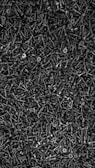 A densely packed arrangement of numerous black screws with a sharp, pointed end and a flat, cross-shaped head. The screws are piled together in a way that their heads and threads interlock, creating a textured, industrial aesthetic.