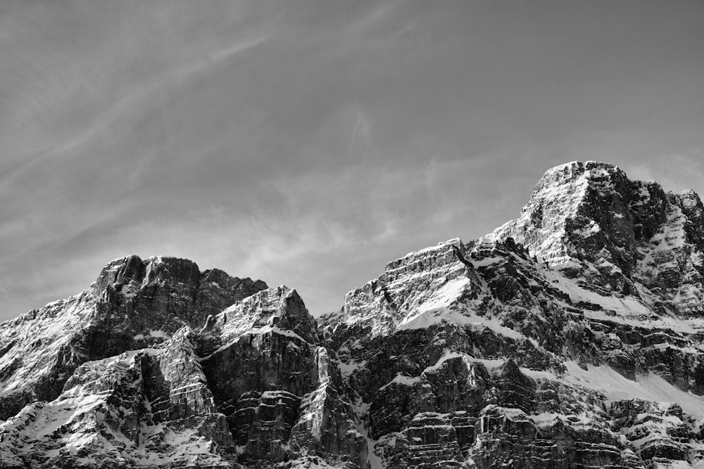 a black and white photo of a mountain range