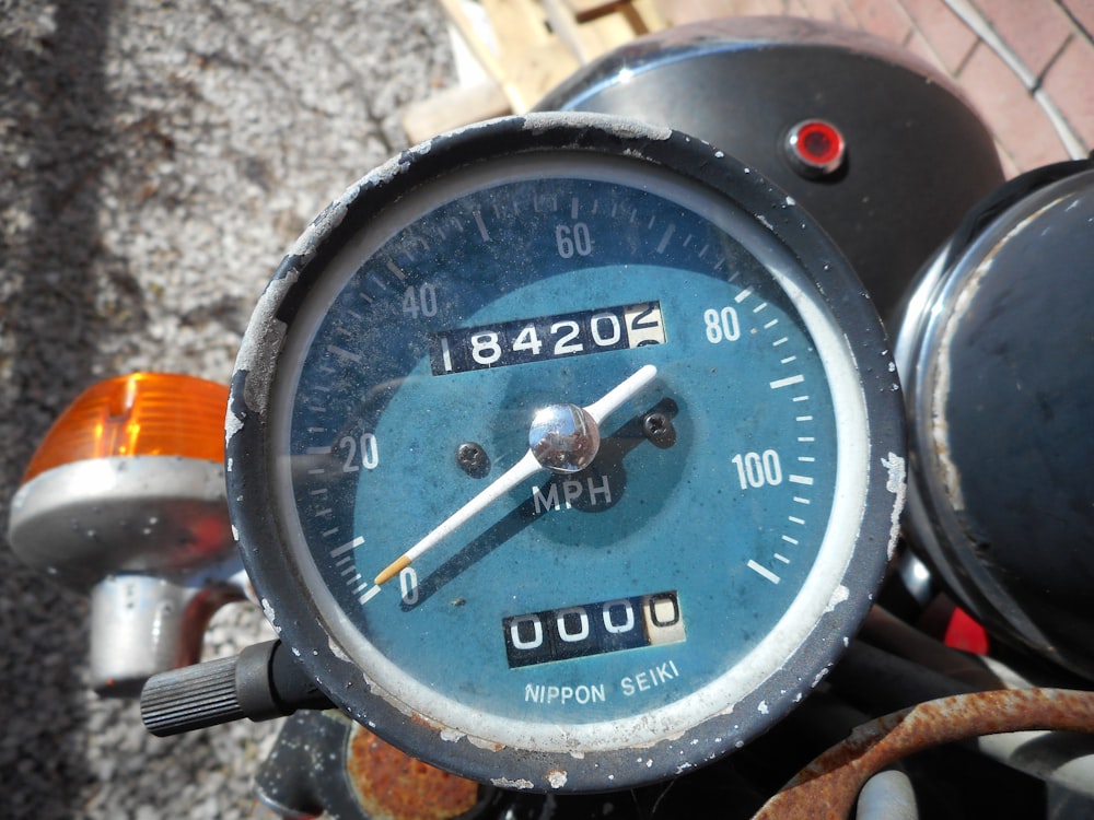 a close up of a speedometer on a motorcycle