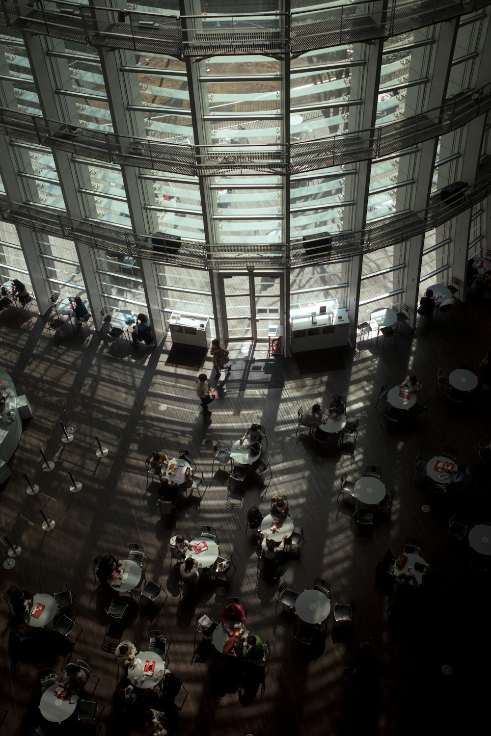 an overhead view of a restaurant with tables and umbrellas