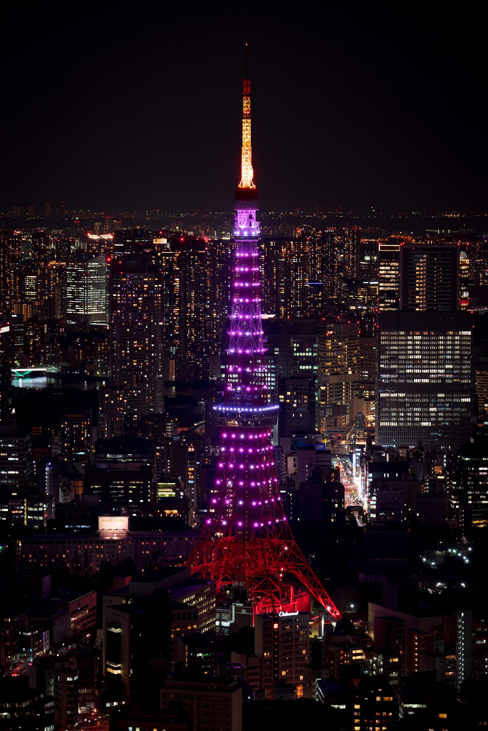 a view of a city at night from the top of a building