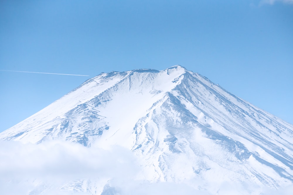 a snow covered mountain with a sky background