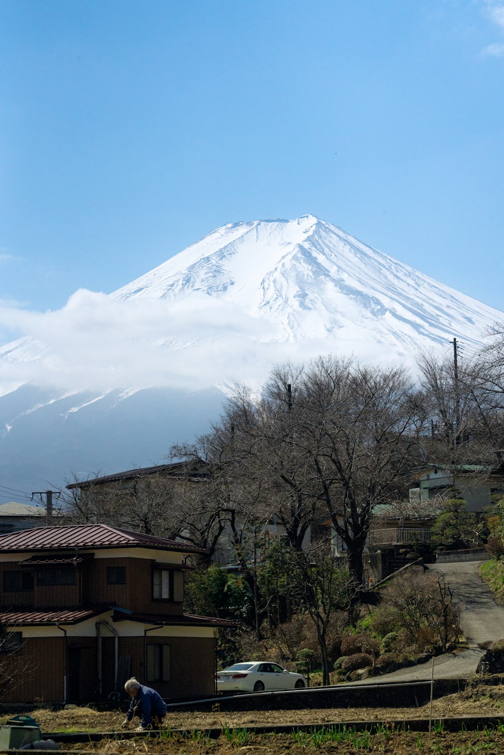 a large white mountain towering over a small town