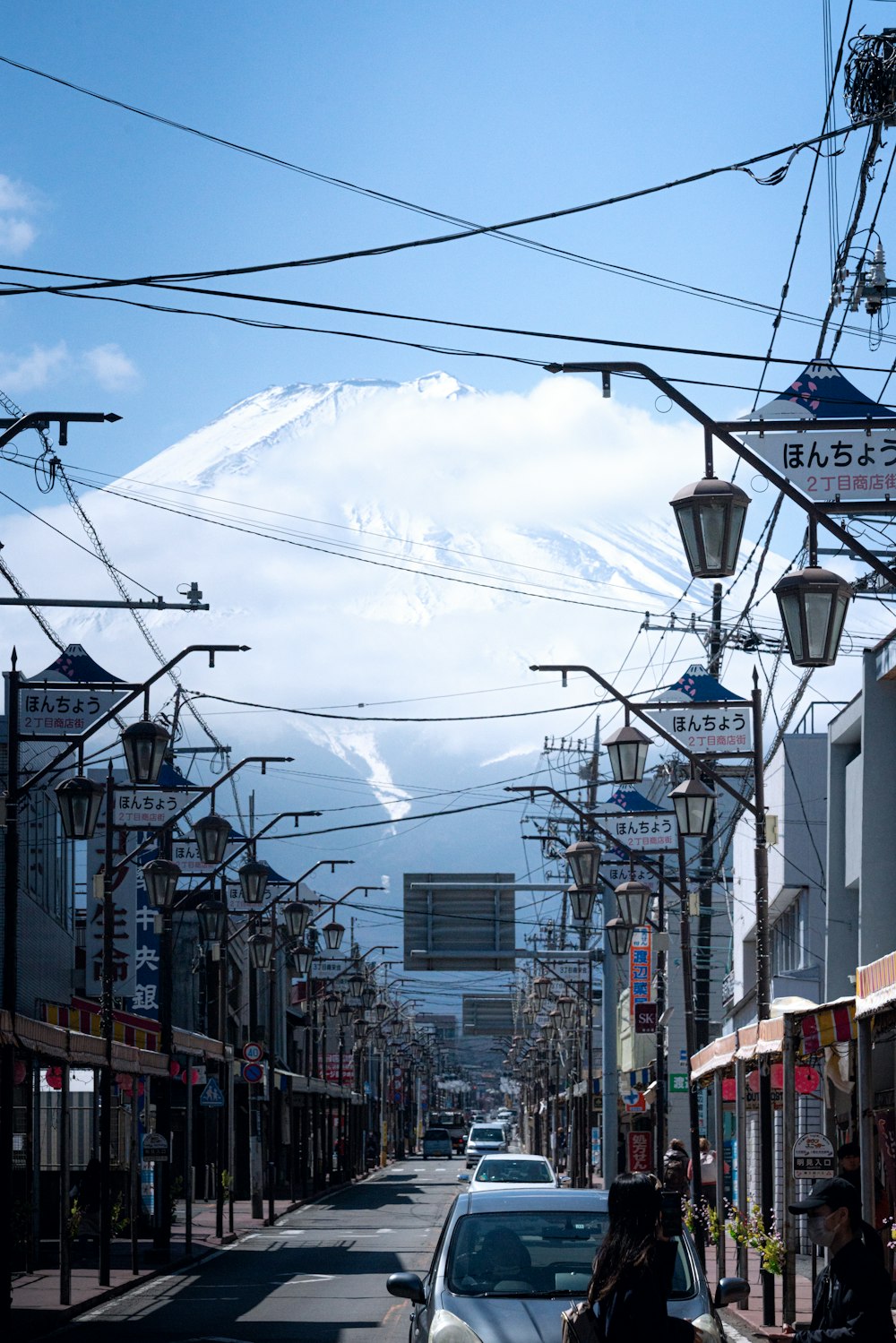 a city street with a mountain in the background