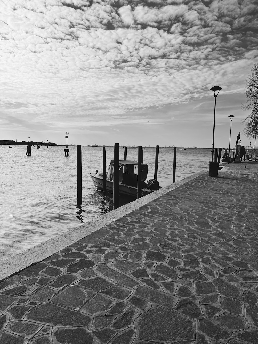 a black and white photo of a boat in the water