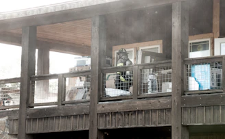 Restoration team carefully cleaning smoke damage inside a residential home.