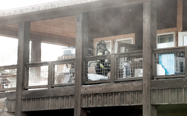 Restoration team carefully cleaning smoke damage inside a residential home.