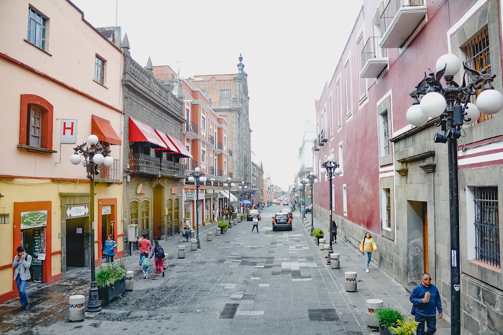 a city street with people walking down it