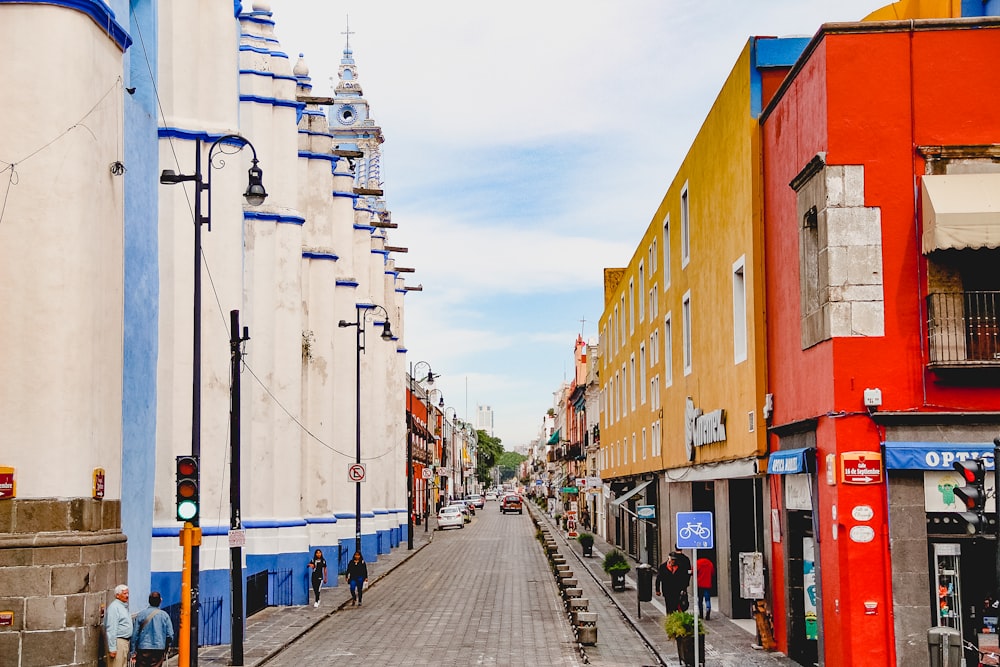 a city street lined with tall buildings next to each other