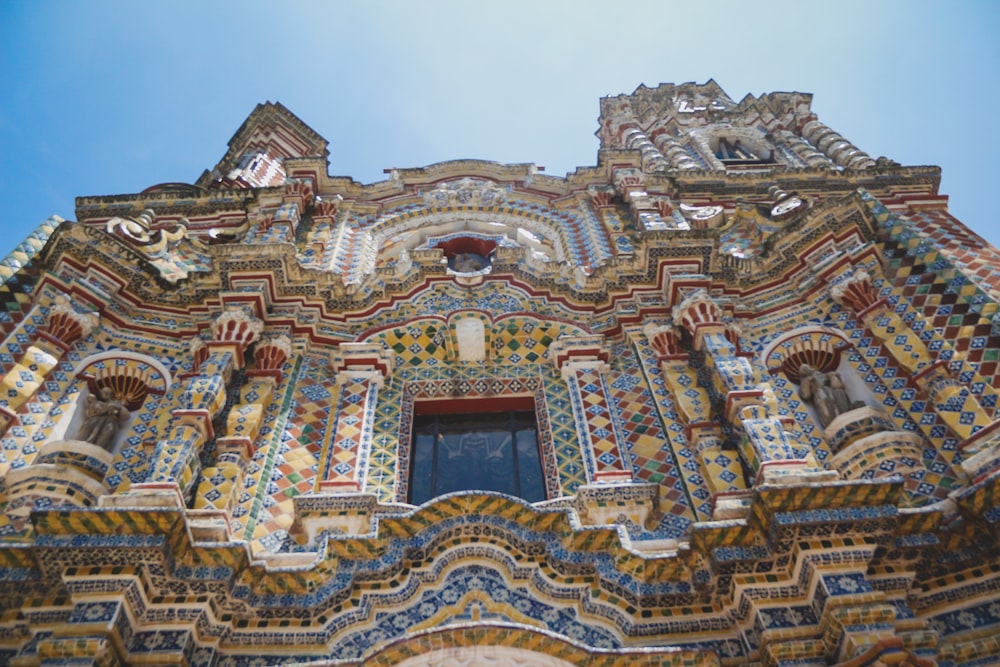 a very ornate building with a blue sky in the background