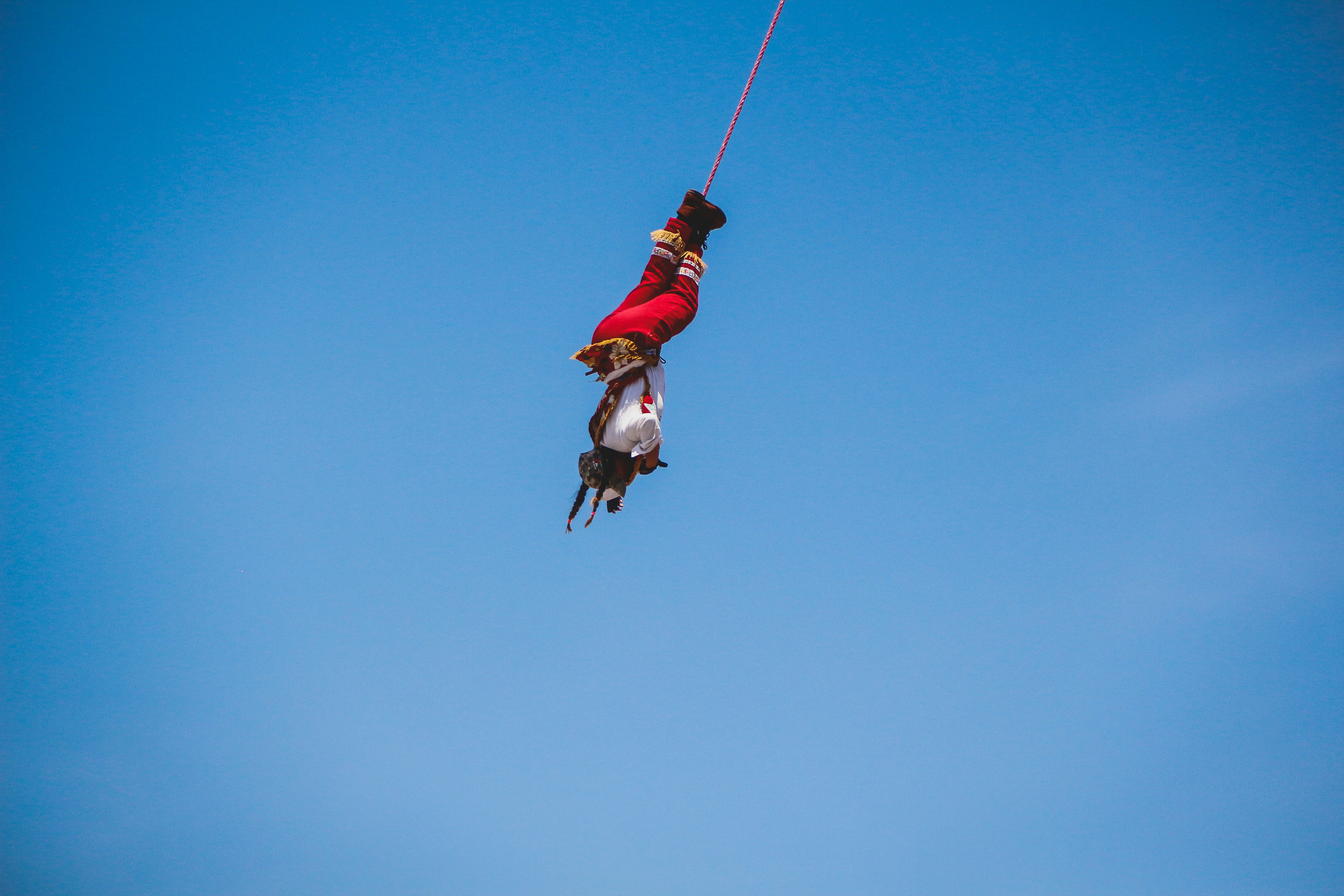 a man in the air on a parasail