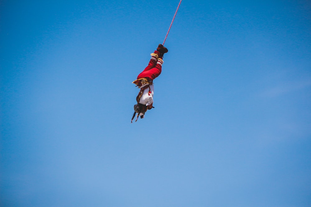 a man in the air on a parasail