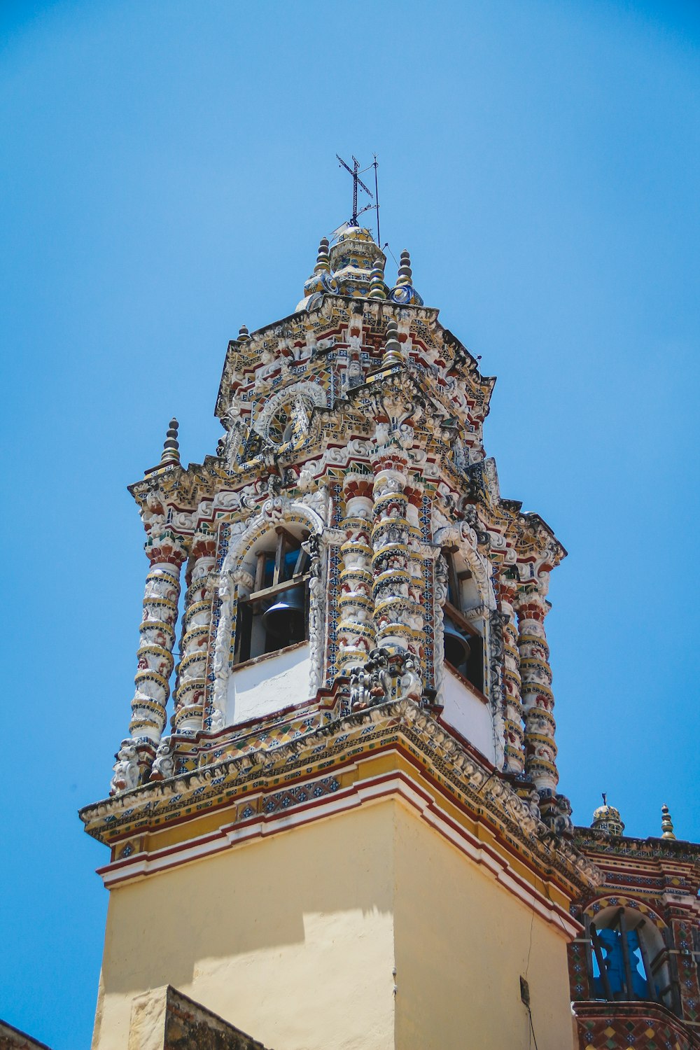 a tall tower with a clock on the top of it