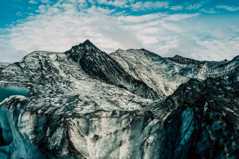 a large iceberg in the middle of a mountain range