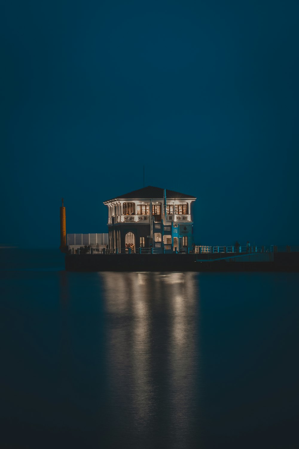 a house sitting on top of a body of water