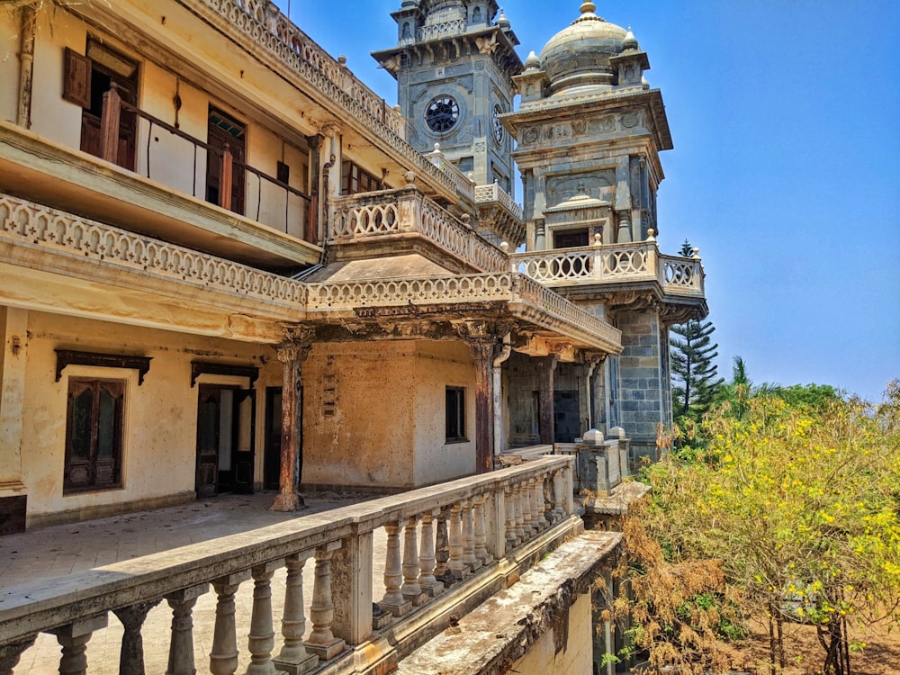 an old building with a clock tower in the background