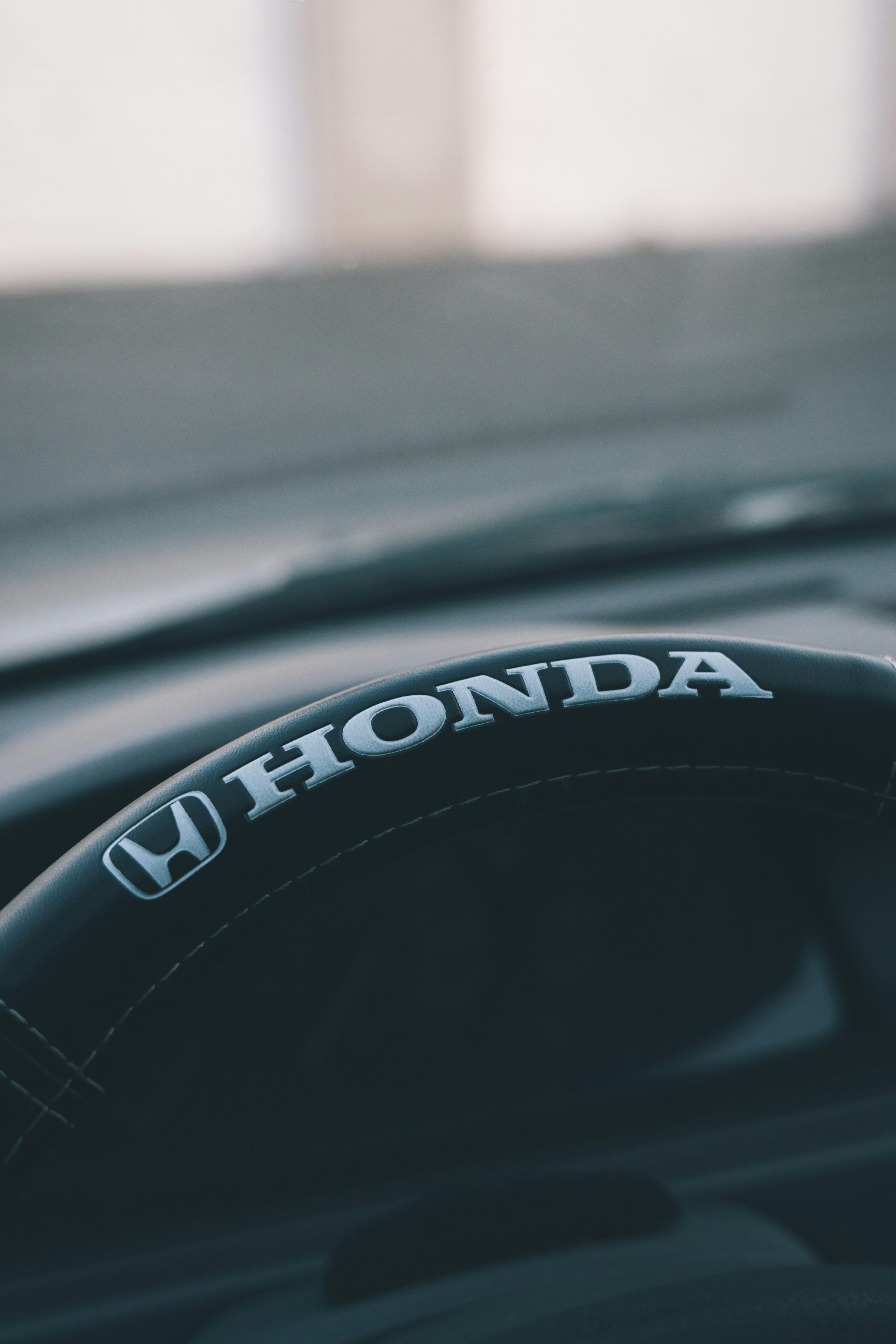 a close up of a steering wheel on a car