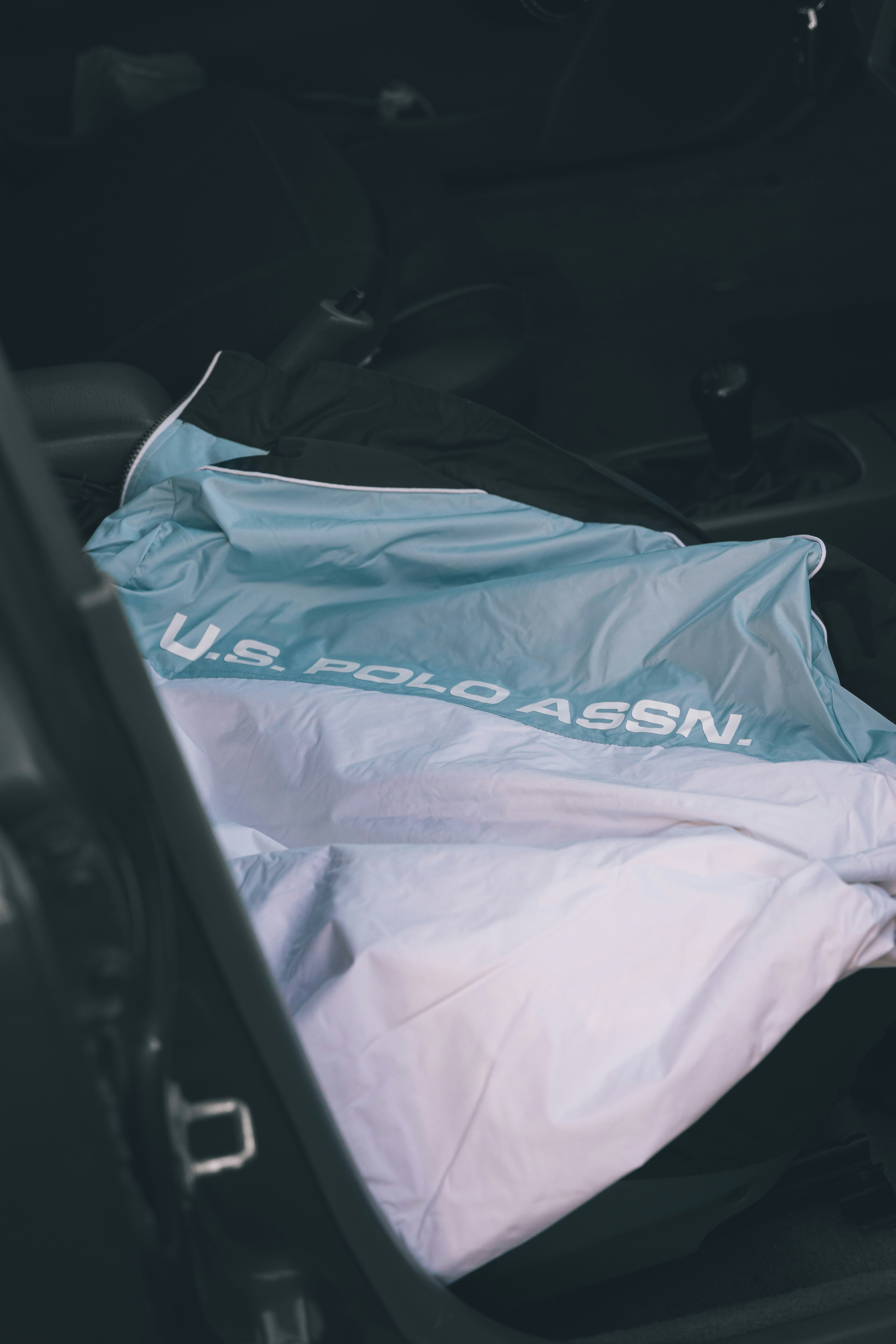 A man wearing a white polo shirt