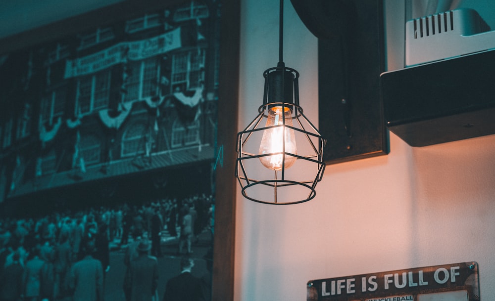 a light bulb hanging from the side of a wall