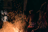 Mysticaura performing a protective spell with focused hands surrounded by flickering flames