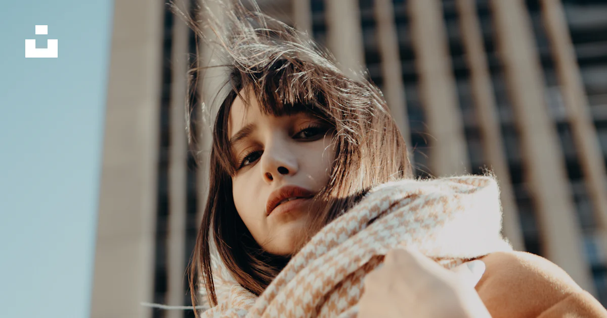 A woman with a scarf around her neck photo – Free Editorial× Image on ...