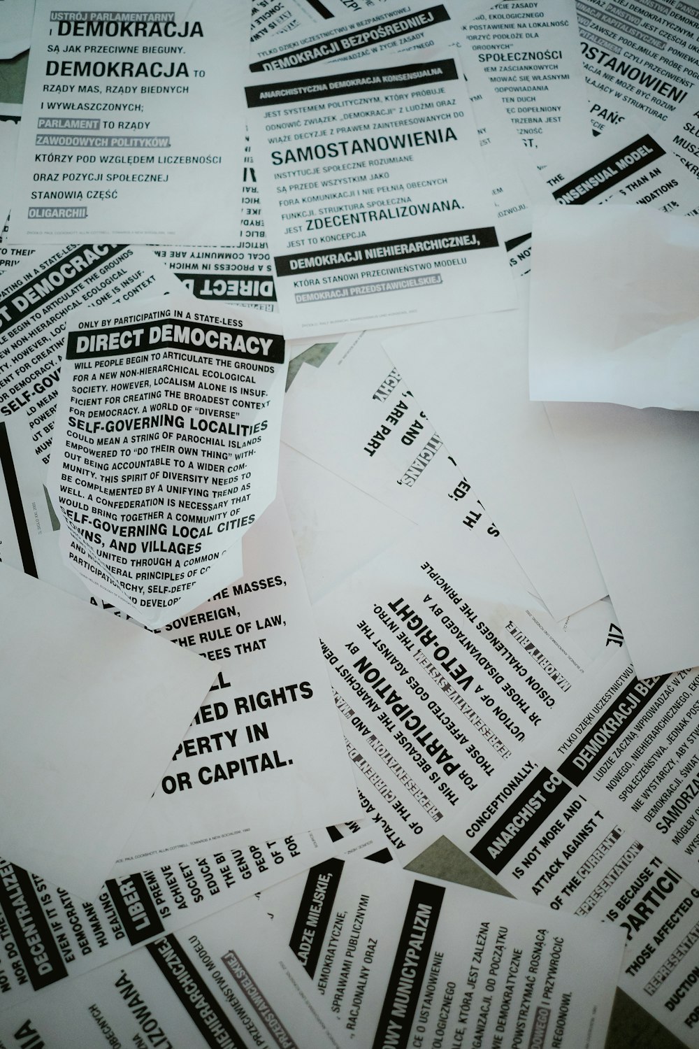 a pile of paper with a lot of black and white labels on it