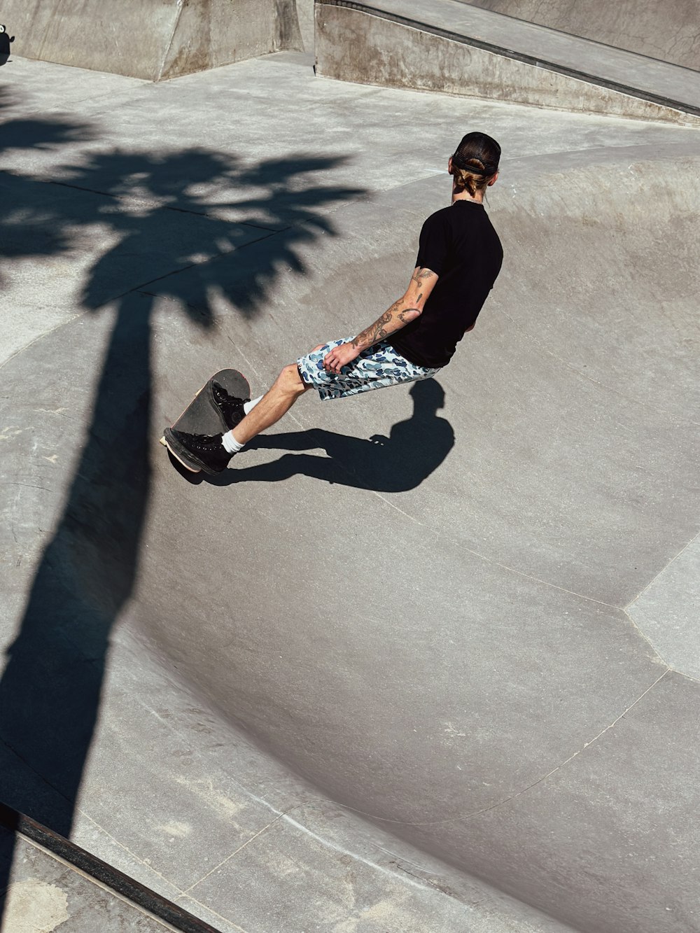 a man riding a skateboard up the side of a ramp