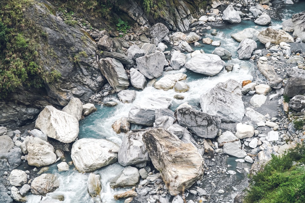 a stream of water running between two large rocks