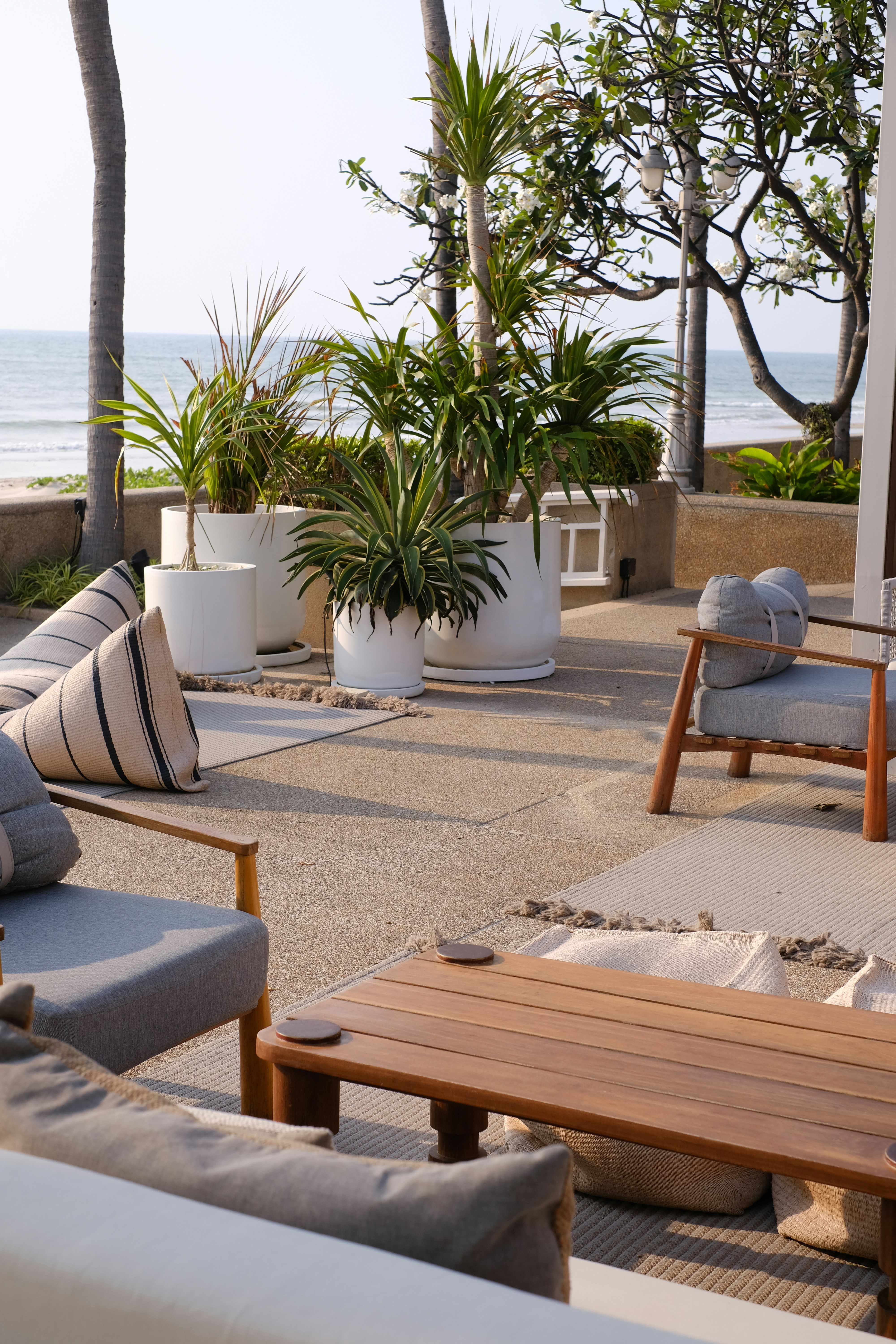 a wooden table sitting on top of a patio