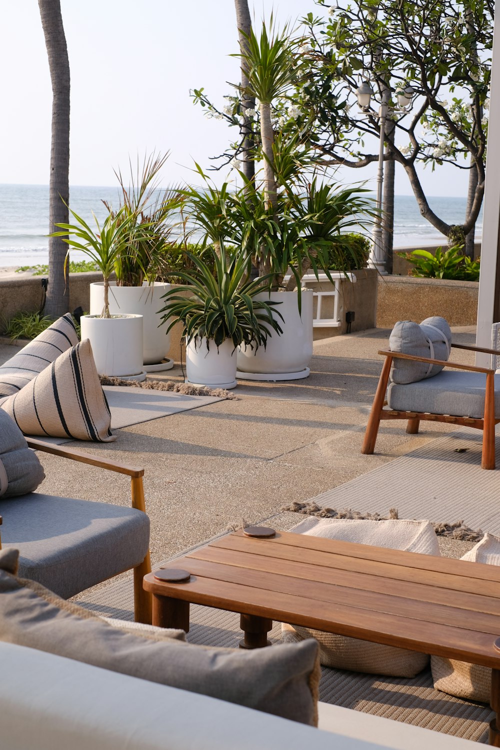 a wooden table sitting on top of a patio