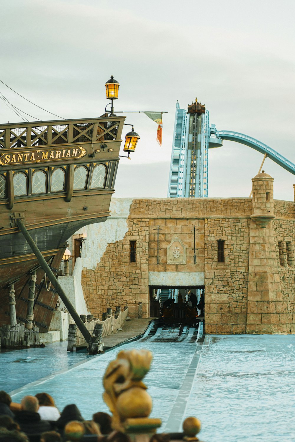 a pirate ship is docked at the entrance to a water park