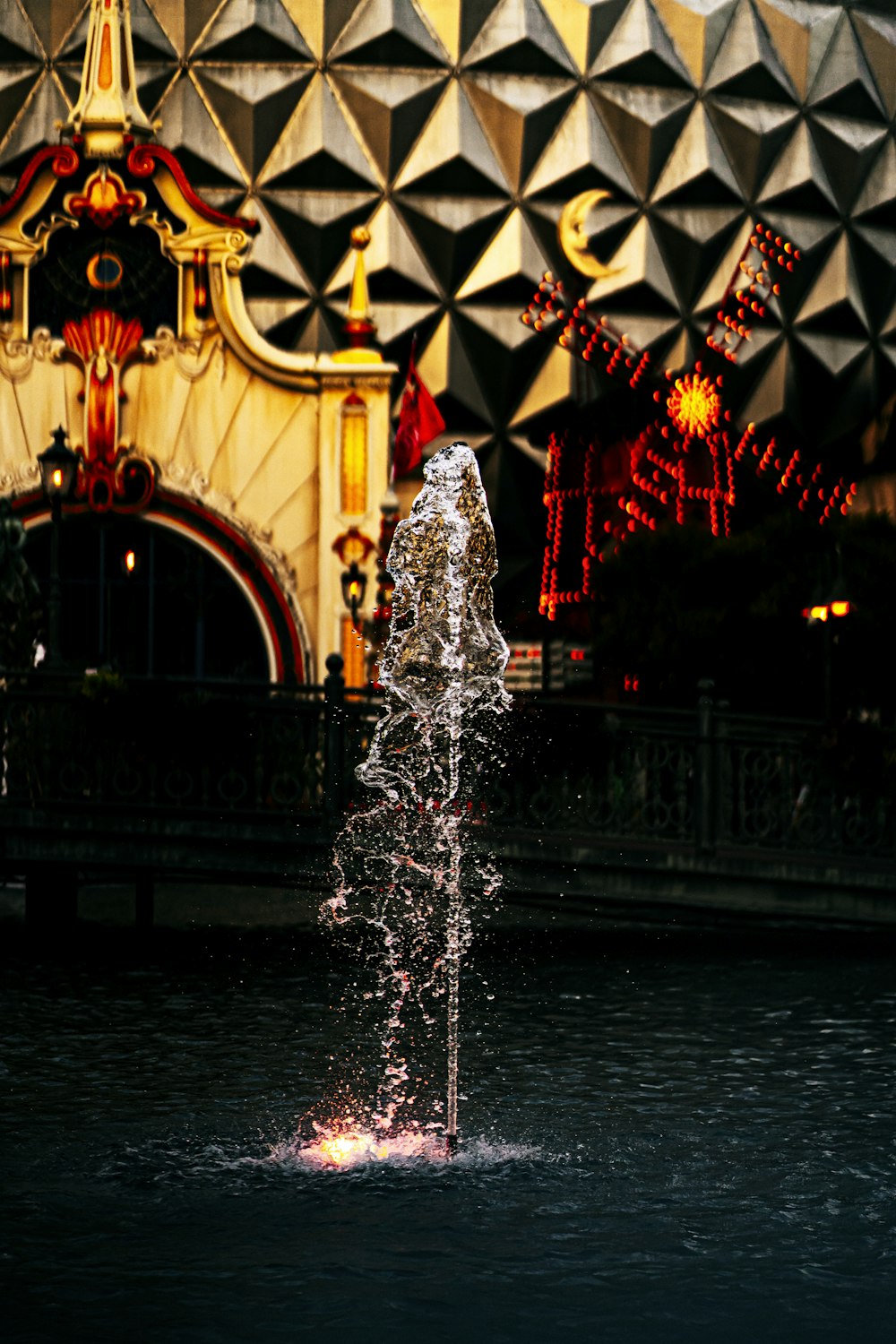 a water fountain in front of a building