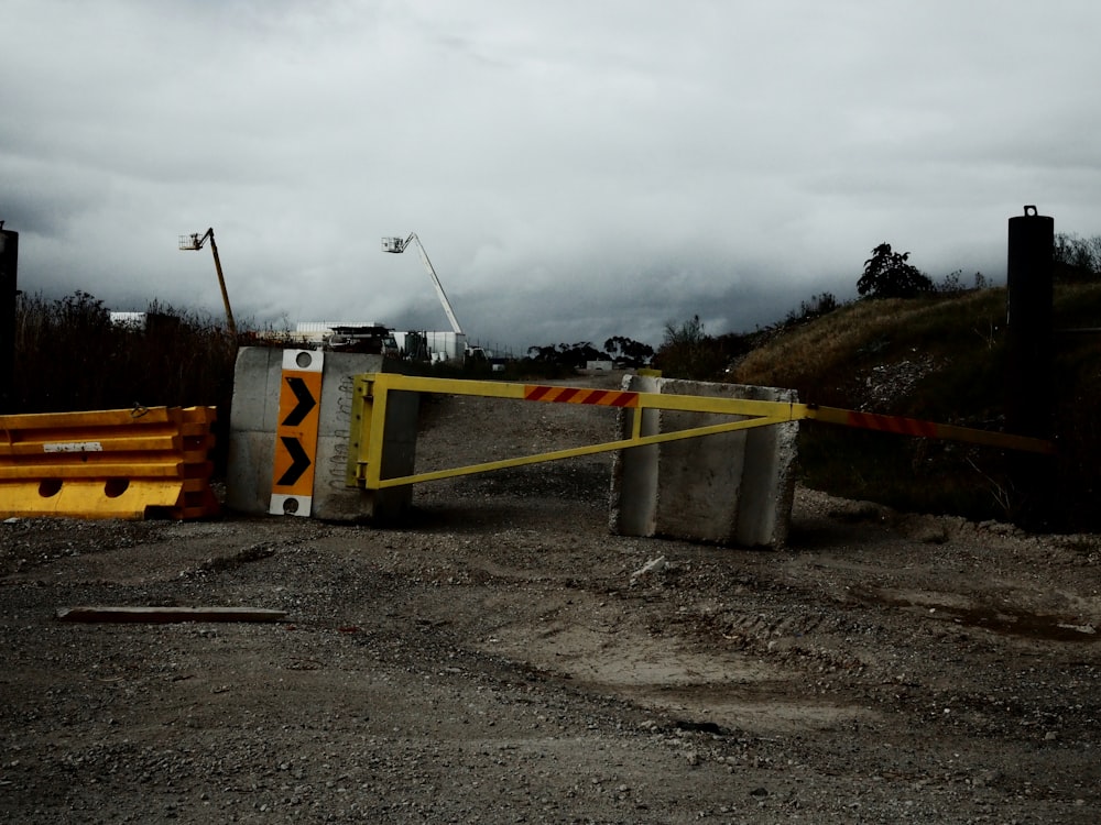 a construction area with a gate and a yellow barricade