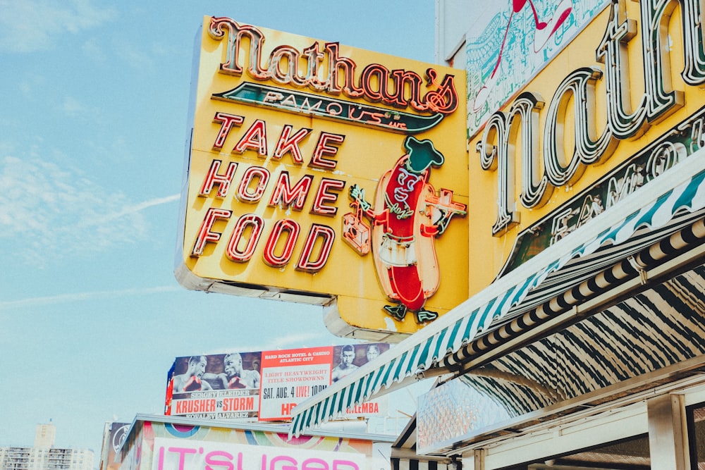 a sign for nathan's take home food on the side of a building