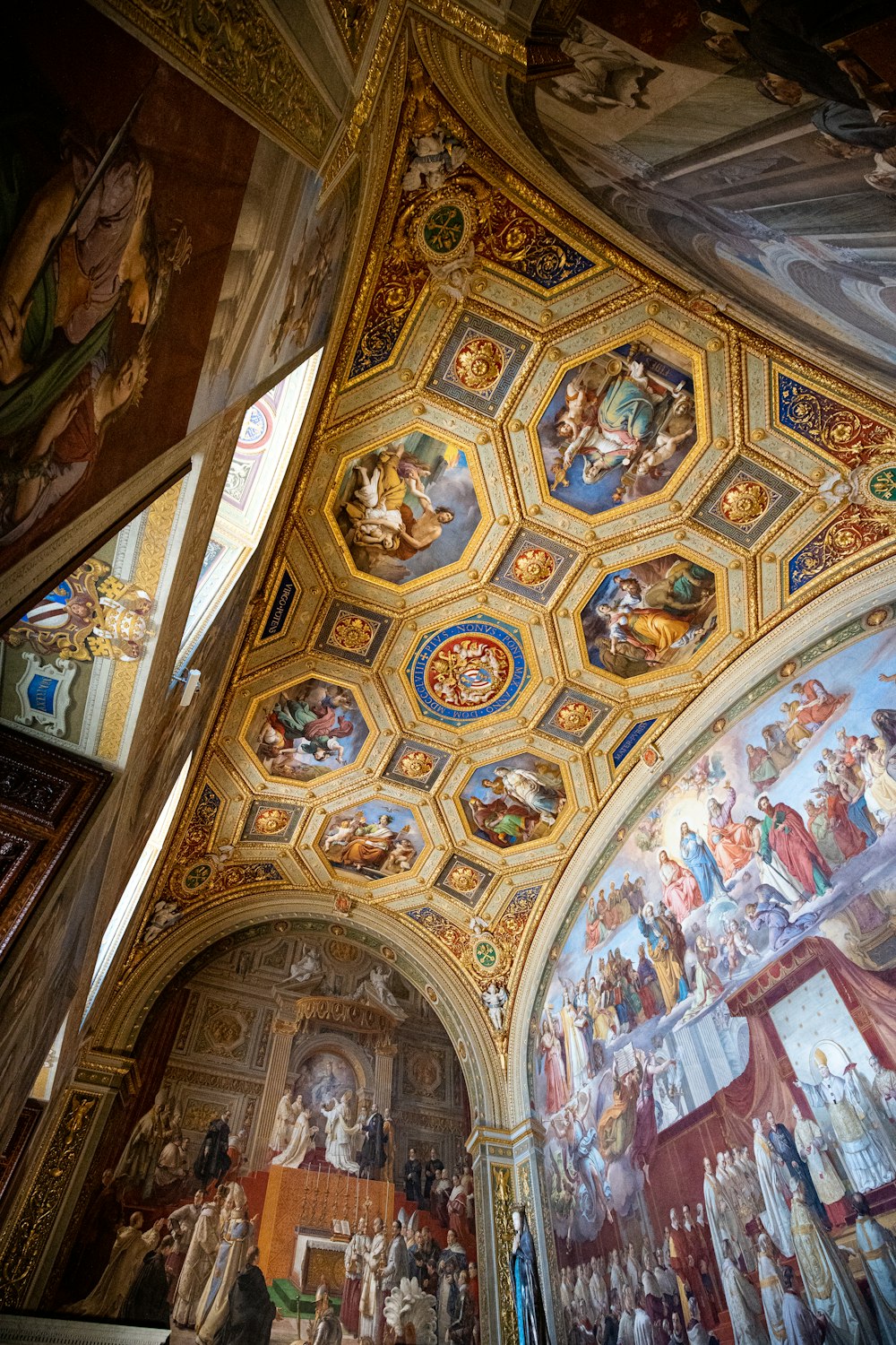 the ceiling of a church with paintings on it