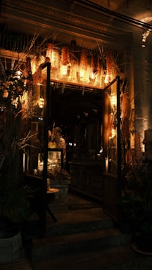 A cozy floral shop interior with wooden shelves and soft lighting.